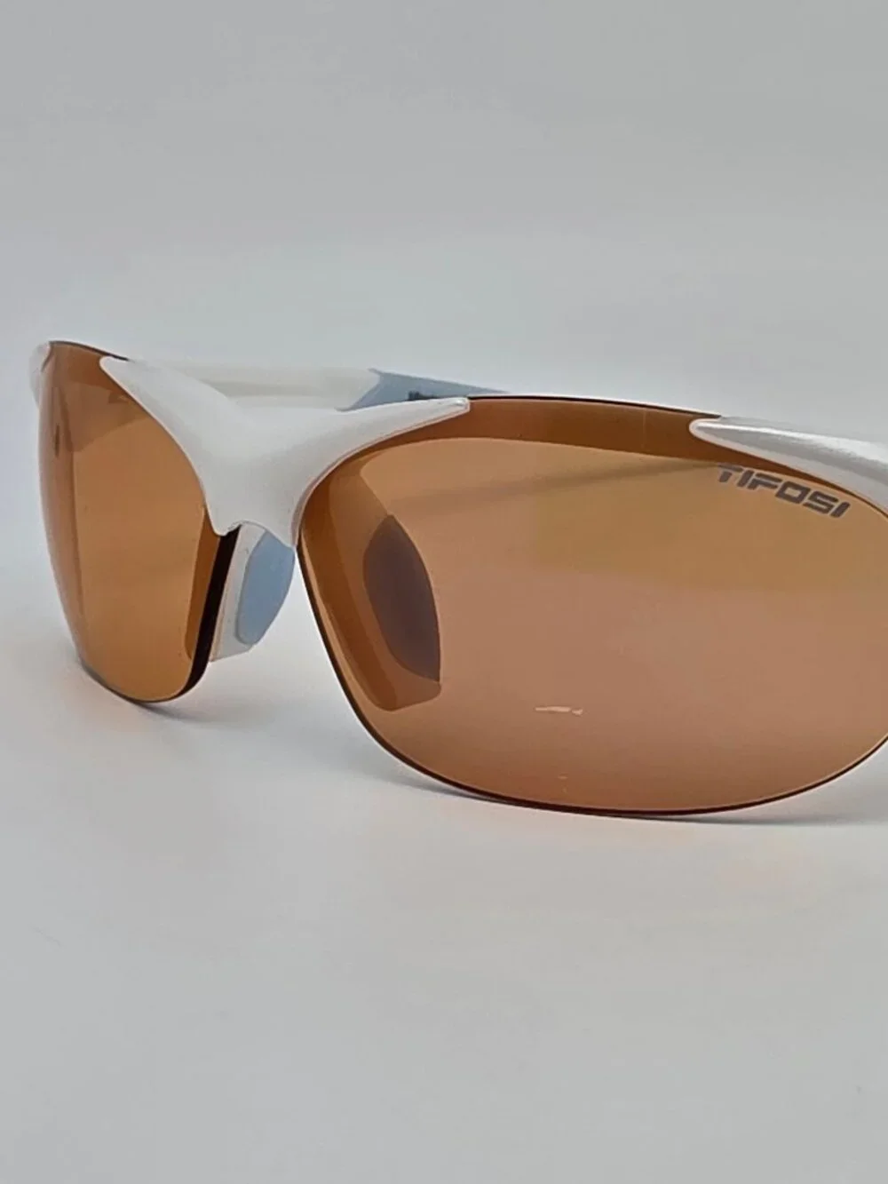 Tifosi Wisp Pearl White Baby Blue Frame Purple Mirror Lens Rimless Sunglasses